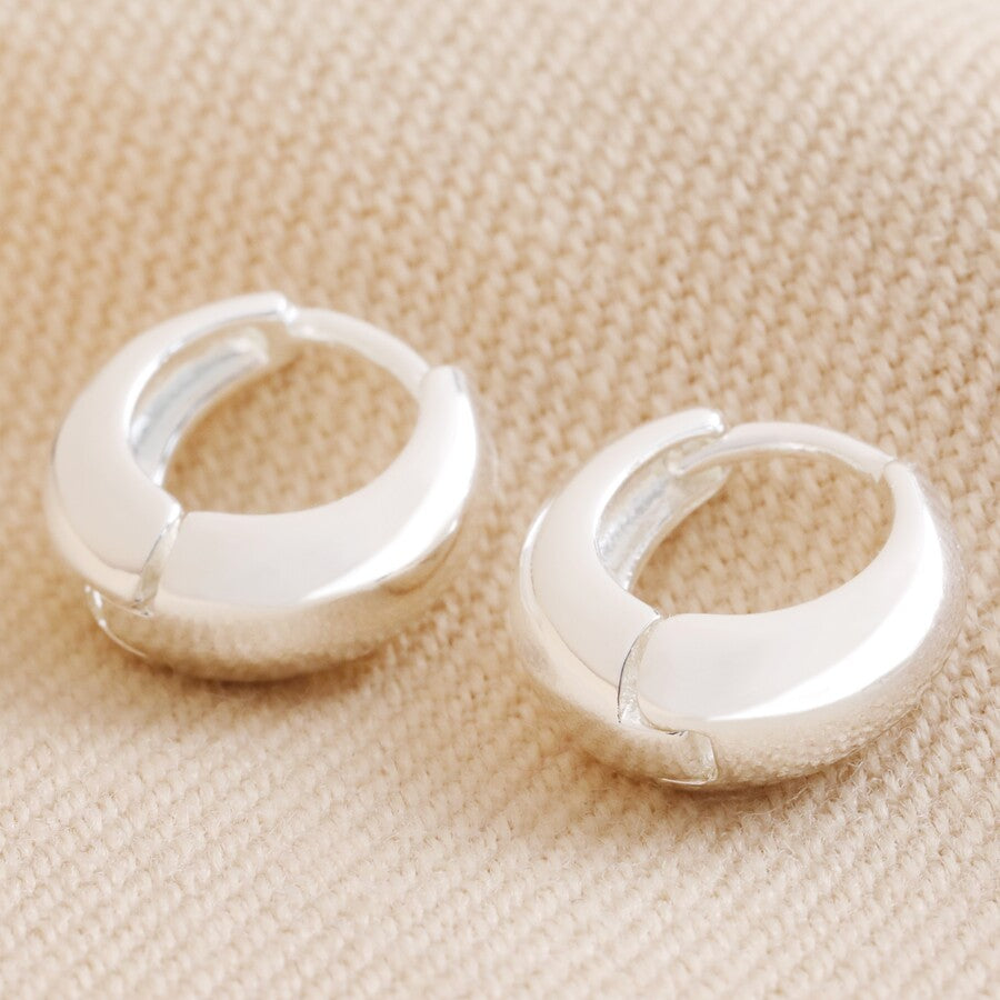 Domed huggie hoop earrings in silver