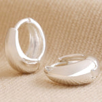 Domed huggie hoop earrings in silver