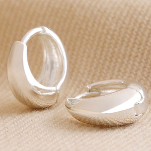 Domed huggie hoop earrings in silver