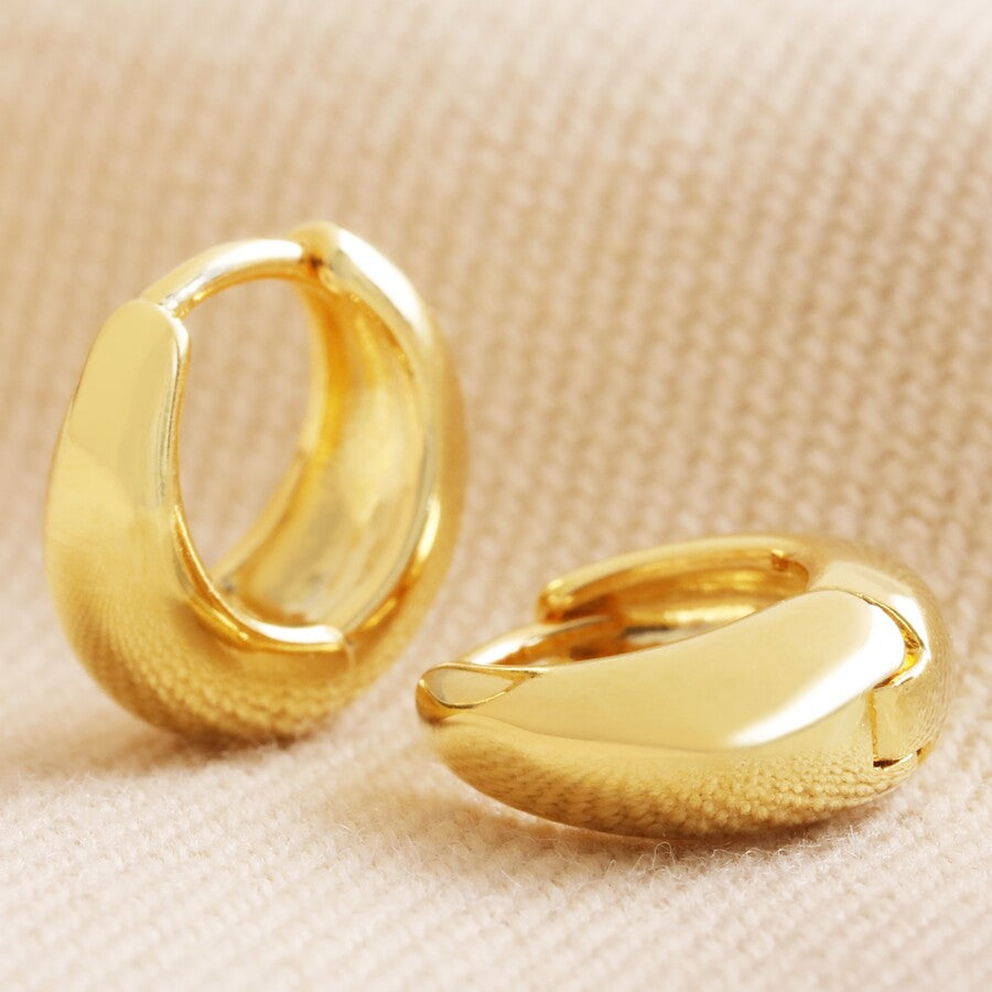 Domed huggie hoop earrings in gold