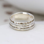 Textured triple spinning band