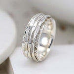 Textured triple spinning band