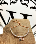 Rose gold and silver love bracelet