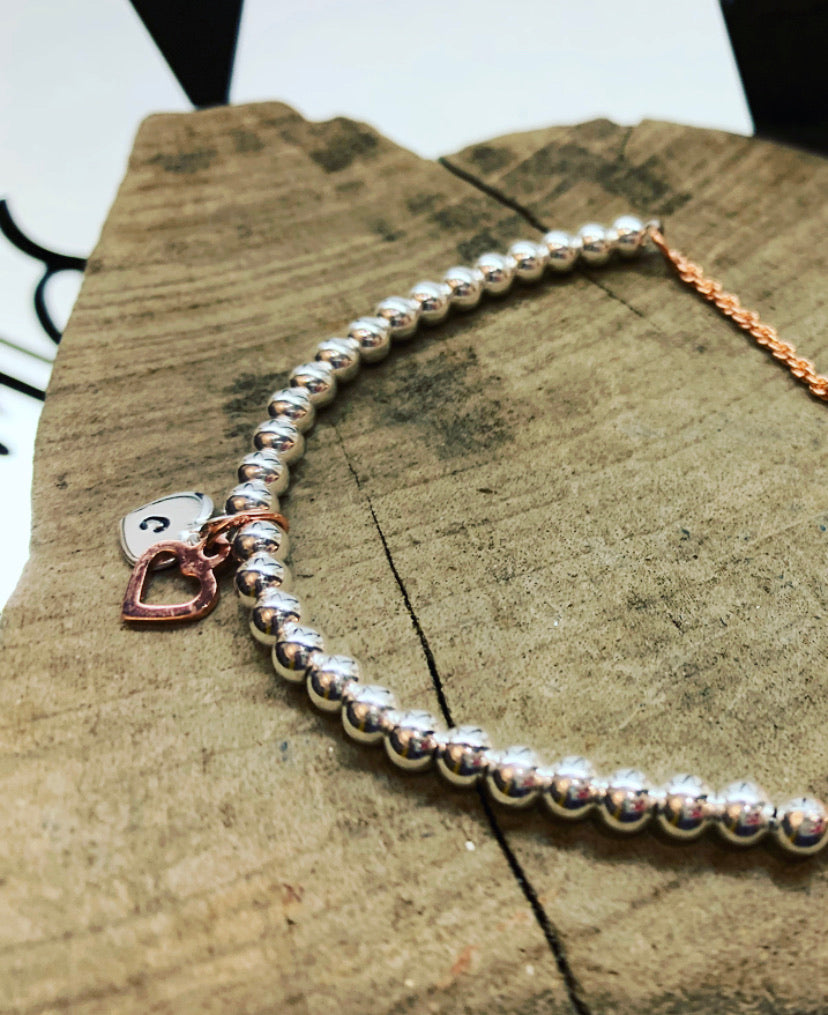 Rose gold and silver love bracelet