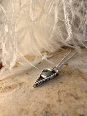 Hearts in hearts ashes pendant